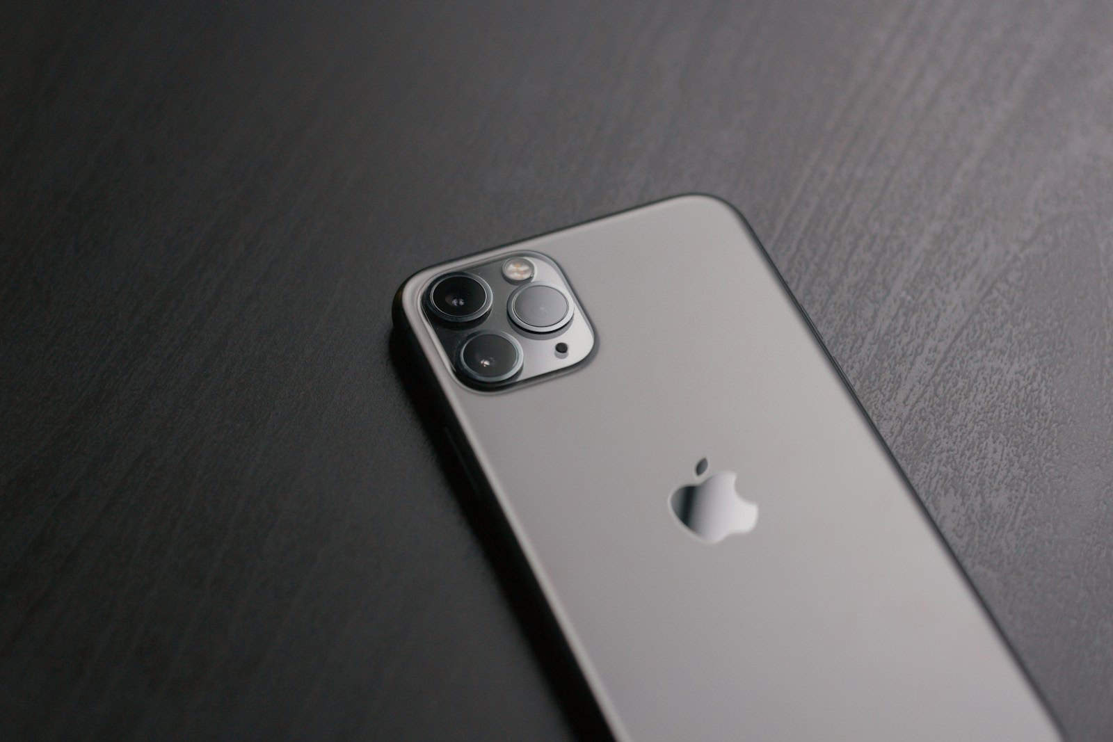 silver iphone 6 on brown wooden table